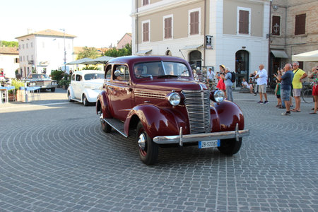 Senigallia, Italy, 10 August 2019 is an international music festival focused on the music and culture of the United States of the 1950s. Pictured: people dressed in 50s style and car paradeのeditorial素材