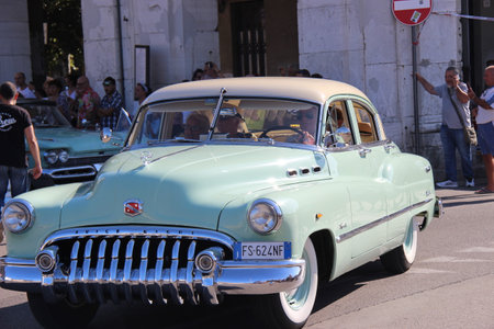 Senigallia, Italy, 10 August 2019 is an international music festival focused on the music and culture of the United States of the 1950s. Pictured: people dressed in 50s style and car paradeのeditorial素材