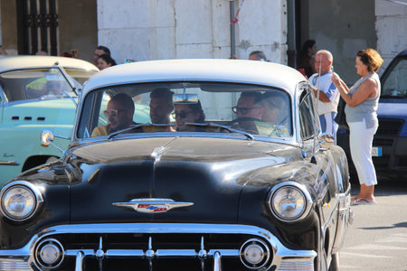 Senigallia, Italy, 10 August 2019 is an international music festival focused on the music and culture of the United States of the 1950s. Pictured: people dressed in 50s style and car paradeのeditorial素材