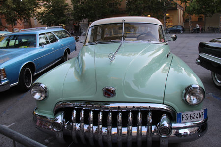 Senigallia, Italy, 10 August 2019 is an international music festival focused on the music and culture of the United States of the 1950s. Pictured: people dressed in 50s style and car paradeのeditorial素材