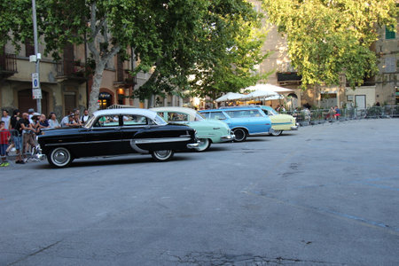 Senigallia, Italy, 10 August 2019 is an international music festival focused on the music and culture of the United States of the 1950s. Pictured: people dressed in 50s style and car paradeのeditorial素材