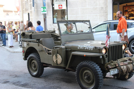 Senigallia, Italy, 10 August 2019 is an international music festival focused on the music and culture of the United States of the 1950s. Pictured: people dressed in 50s style and car paradeのeditorial素材