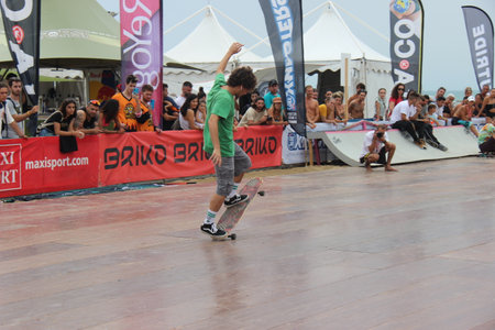 Senigallia, Marche, Italy, July 25, 2021 fantastic evolutions by these sportsmen without distinction of sex using a longer skateboard Evolutions on the Longboardのeditorial素材