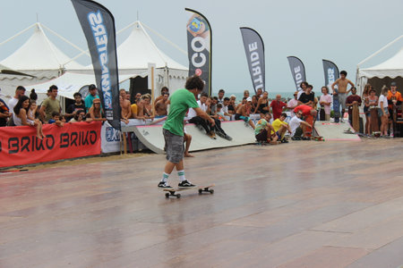 Senigallia, Marche, Italy, July 25, 2021 fantastic evolutions by these sportsmen without distinction of sex using a longer skateboard Evolutions on the Longboardのeditorial素材