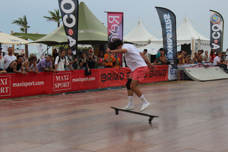 Senigallia, Marche, Italy, July 25, 2021 fantastic evolutions by these sportsmen without distinction of sex using a longer skateboard Evolutions on the Longboardのeditorial素材