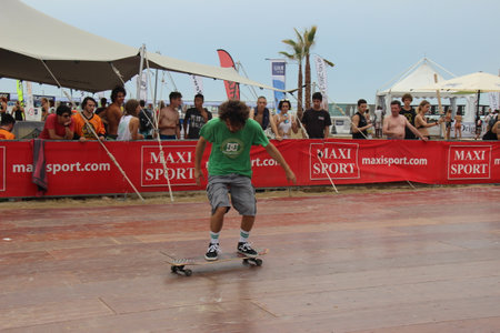 Senigallia, Marche, Italy, July 25, 2021 fantastic evolutions by these sportsmen without distinction of sex using a longer skateboard Evolutions on the Longboardのeditorial素材