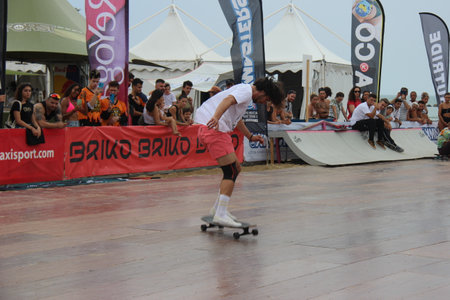 Senigallia, Marche, Italy, July 25, 2021 fantastic evolutions by these sportsmen without distinction of sex using a longer skateboard Evolutions on the Longboardのeditorial素材