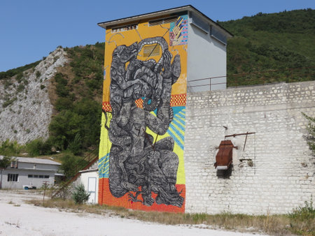 A mural in the void in the mountains in a historic building of a long-closed factoryのeditorial素材
