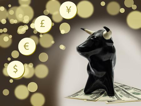 Dollar currency notes with bull on background with bokeh effectの写真素材