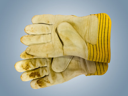 Work leather gloves in dirty and used condition