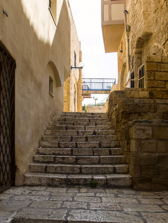 Alley and ladder of the ancient and historical city of Jaffa, Israelの写真素材