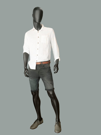 Full length male mannequin dressed casual clothes, isolated on gray backgeround.の写真素材
