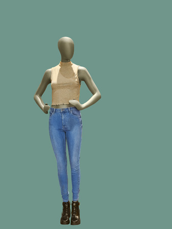 Full-length female mannequin dressed in blue  jeans and pink top, isolated. No brand names or copyright objects.の写真素材