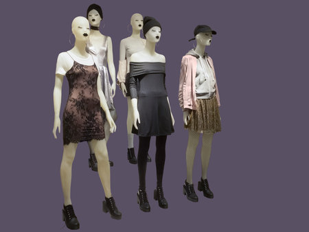 Group of female mannequins wear fashionable clothes, isolated. No brand names or copyright objects.の写真素材