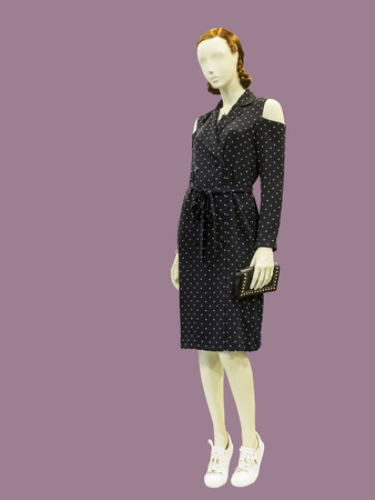 Full-lens female mannequin wearing fashionable modern clothes, isolated. No brand names or copyright objects.の写真素材