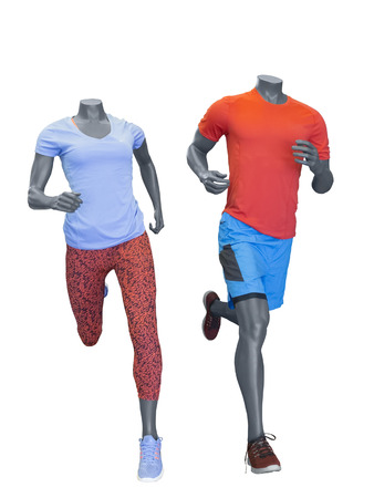 Two running mannequins isolated on a white background. No brand names or copyright objects.の写真素材