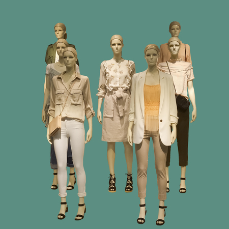 Group of female mannequins wear fashionable summer clothes, isolated. No brand names or copyright objects.の写真素材