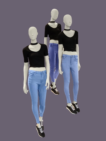 Three female mannequins dressed in casual, isolated. No brand names or copyright objects.の写真素材