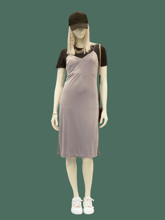 Full-length female mannequin dressed in casual clothes, isolated on green background. No brand names or copyright objects.の写真素材