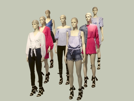 Group of female mannequins wear fashionable summer clothes, isolated. No brand names or copyright objects.の写真素材