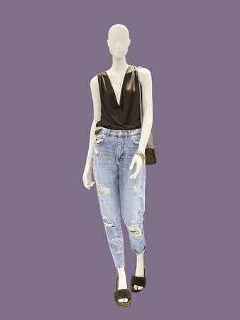 Full-length female mannequin dressed in top and blue jeans, isolated. No brand names or copyright objects.の写真素材