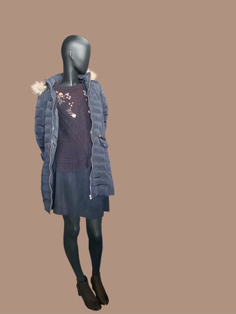 Full-length female mannequin dressed in warm casual clothes, isolated. No brand names or copyright objects.の写真素材