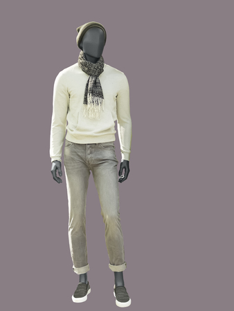 Full-length male mannequin dressed in warm casual clothes, isolated. No brand names or copyright objects.の写真素材