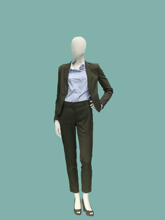 Full-length female mannequin dressed in fashionable trouser suit. No brand names or copyright objects.の写真素材