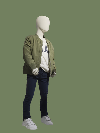 Child mannequin dressed in fashionable kids wear, isolated. No brand names or copyright objects.の写真素材
