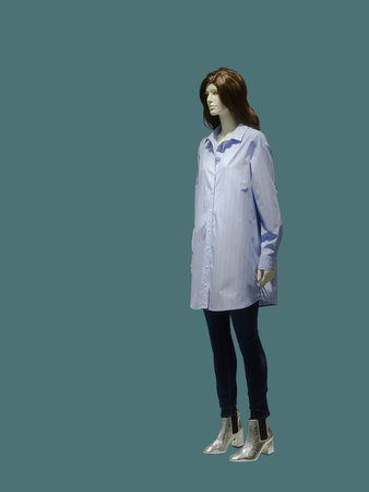 Full-length female mannequin wearing shirt dress, isolated. No brand names or copyright objects.の写真素材