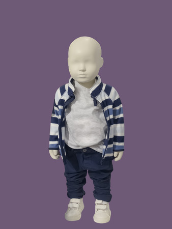 Full-length child mannequin dressed in fashionable kids wear, isolated. No brand names or copyright objects.の写真素材