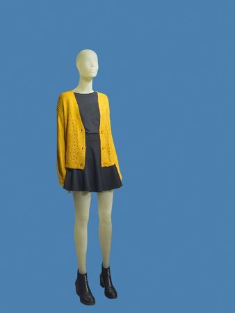Full-length female mannequin dressed in casual clothes, isolated on blue background. No brand names or copyright objects.の写真素材