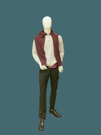 Full-length male mannequin dressed in sweater and trousers, isolated.  No brand names or copyright objects.の写真素材