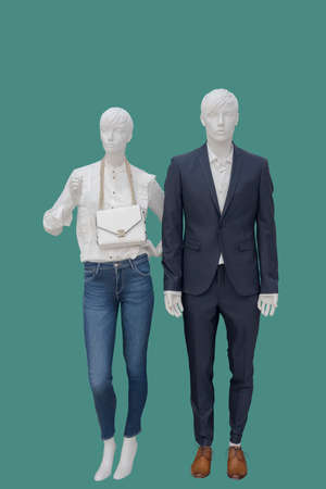 Full-length two mannequins, male and female, dressed in fashionable clothes, isolated. No brand names or copyright objects.の写真素材