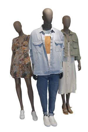 Three mannequins dressed in fashionable clothes isolated on white background. No brand names or copyright objects.の写真素材