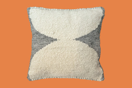 Decorative black and white cushion with knitted pattern. Isolated.の写真素材