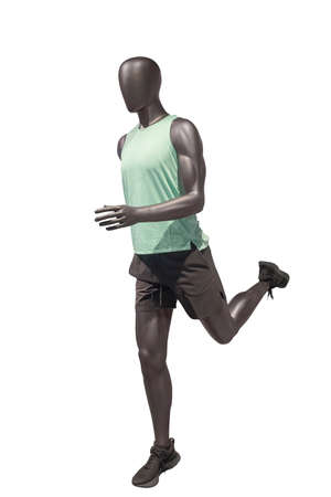 Full length image of a running male display mannequin wearing sportswear isolated on a white background.の写真素材