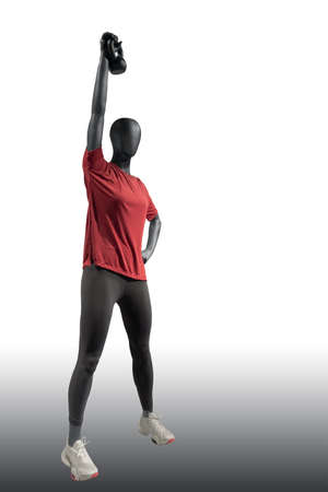 Full length image of a female display mannequin dressed in sportswear, isolated on white backgroundの写真素材