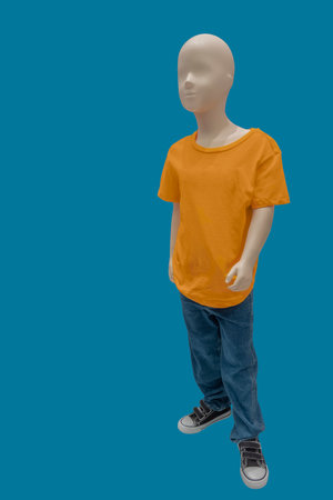 Full length image of a child display mannequin wearing summer casual clothes isolated on blue backgroundの写真素材