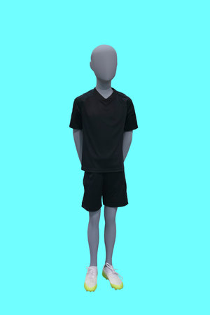 Full length image of a child display mannequin wearing black t-shirt and shorts isolated on blue...
