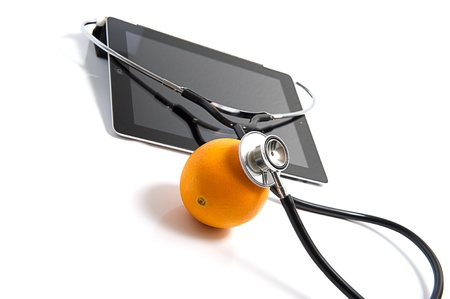 Examines an orange nutritive value.の写真素材