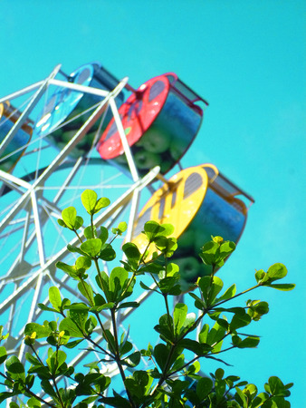 Colorful Ferris Wheel on a sunny dayの写真素材