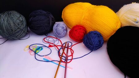 group of colorful yarn balls with crocheting accessories .close up shotの写真素材