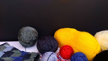 group of colorful yarn balls with crocheting accessories .close up shotの写真素材
