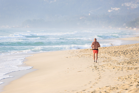Man running by the seaの写真素材