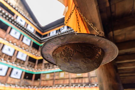 Alms bowl hanging from the eavesの写真素材