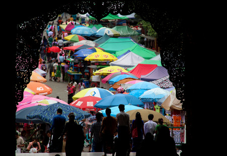 Market with colorful umbrellas in front of the "Shwedagon" Pagoda in Yangon, Myanmar / Burma.のeditorial素材