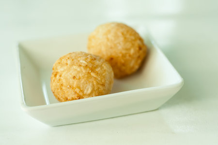 Sticky rice  a round mold and then deep fried