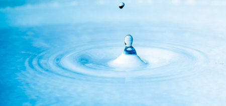 close up drop of water blue color