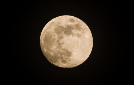 yellow light of moon on the dark backgroundの写真素材